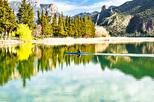 Man kayaking on the reservoir in the Sant Lloren&ccedil; de Montgai Natural Park, Noguera region, Lleida, Catalonia. Nature, water sports