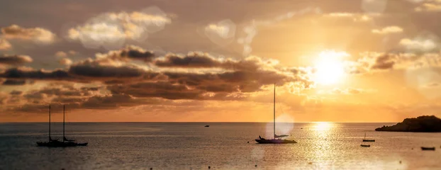 Magnificent sunset above the Mediterranean Sea and sailboats silhouette. Ibiza, Spain © Alex Tihonov