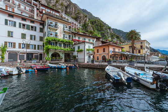 Scenic landscape of Limone sul Garda village, Lake Garda, Italy. Picturesque colorful houses and a peaceful harbor surrounded by blue waters and majestic alpine mountains. - Limone sul Garda, may 2026