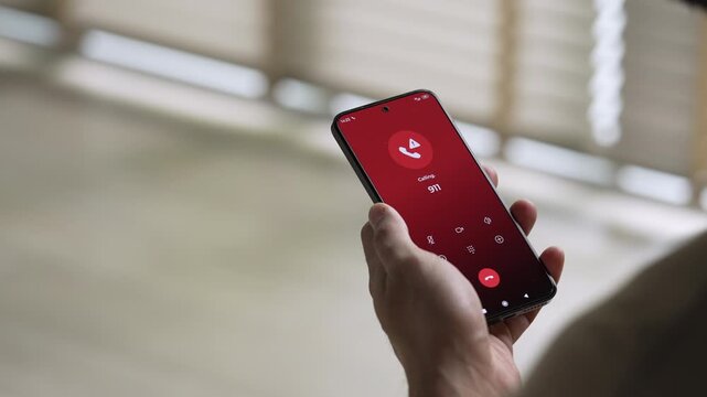 Man calling emergency number 911 for crisis situation