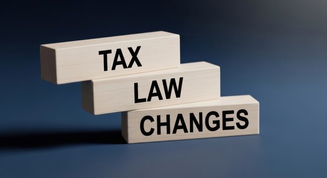 Tax Law Changes text on wooden blocks, financial regulation and accounting concept, stacked white bricks on blue background