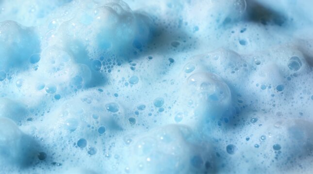 Light blue soapy foam with bubbles 
