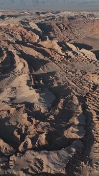 Atacama Desert, Chile. San Pedro de Atacama, Valle de la Luna. Aerial view by drone. Vertical video