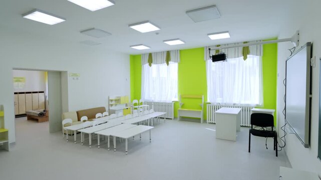 Open room connects classroom area with storage space. Large bright hall offers plenty of room for movement. Spacious area for active kids