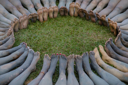 Sao Paulo, SP, Brazil - maio 26 2026: Female feet and legs with black clay in a circle details.