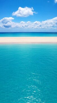 Vivid turquoise waters meet a clear blue sky, creating a tranquil beach paradise perfect for relaxation and escape.