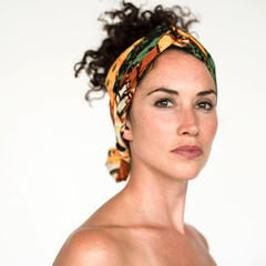 Naklejka premium Confident woman with colorful headscarf.