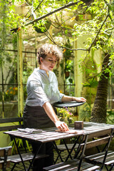 Outdoor cafe setting with server