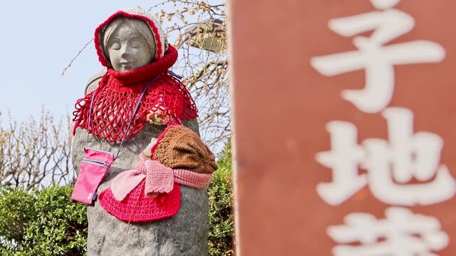 Tilt Up Jizo Statue With Japanese Sign Sensoji Temple Tokyo Japan