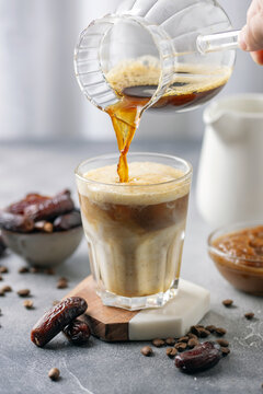 Iced coffee dates latte cup. Alternative trendy vegan drink