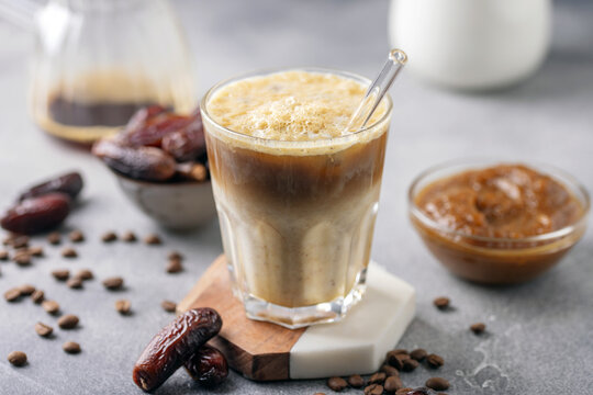 Iced coffee dates latte cup. Alternative trendy vegan drink