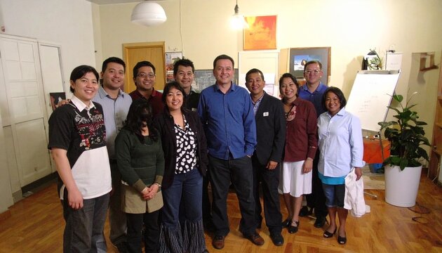 Group of People Standing Together Indoors.