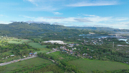 Naklejka premium Empty land opportunity abundant Danao City Cebu Philippines peaceful farm nature rural valley panoramic view mountain river landscape tropical sky clouds, agriculture residential and commercial