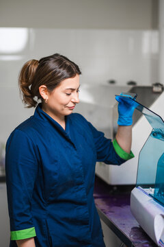 Laboratory Technician Diligently Managing Instrument Functions While Ensuring Sample Accuracy And Safety