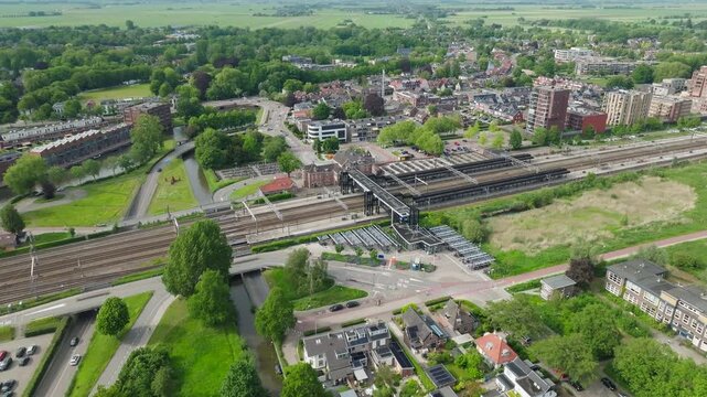 Woerden railway train station aerial with typical Dutch town landscape in Netherlands