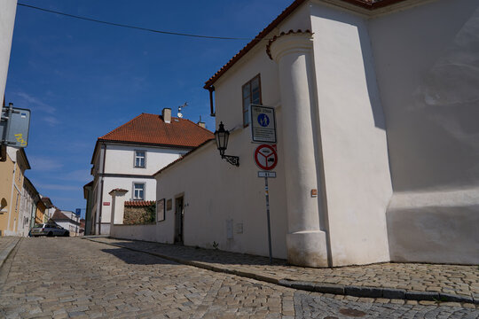 Pisek, Czech Republic - April 18, 2026 - Putim Gate. Cobblestone street in an old European town with traditional architecture and blue sky