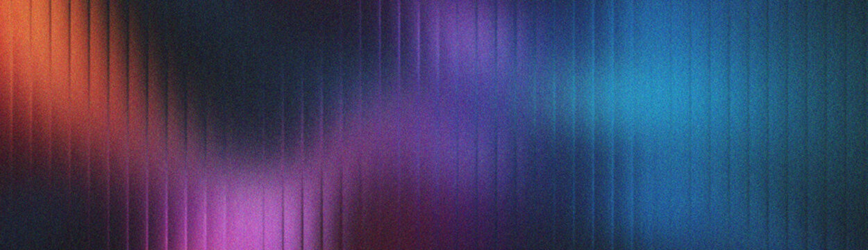 Vibrant color spectrum on grainy glass texture for creative backdrop.