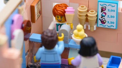 Obraz premium Tambov, Russian Federation - January 19, 2026 Lego Italian gelateria with seller and buyers inside.