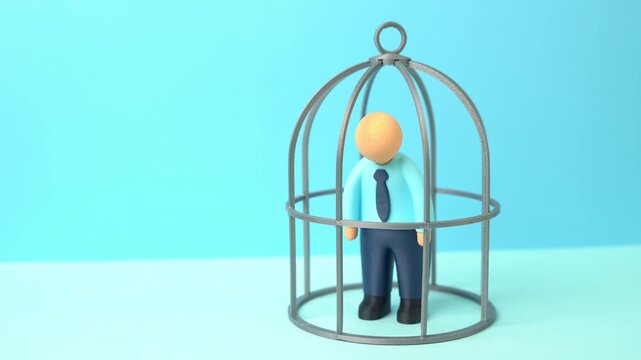 Office worker in a cage. Contractual obligations. NDA agreement. Restrictions and self-isolation from opportunities for growth and development. Limited freedom, and workplace pressure. Employment law
