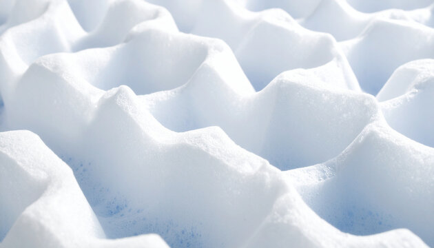 Geometric white foam surface with blue tint