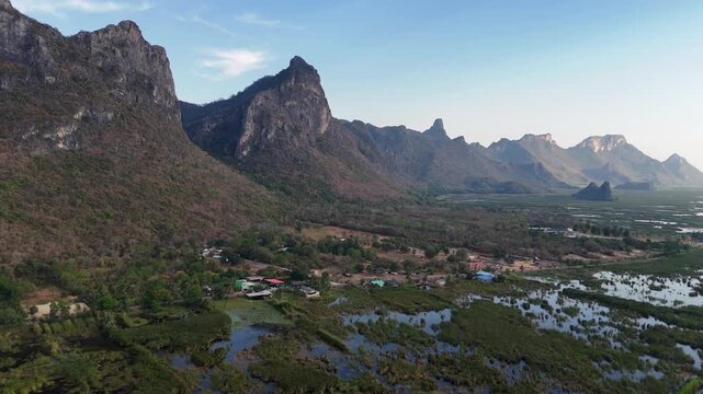 Aerial Drone View Of Bueng Bua Wetlands Thailand
Aerial drone footage of Bueng Bua Wood Boardwalk wetlands and limestone mountains in Thailand on 19 May 2026.

