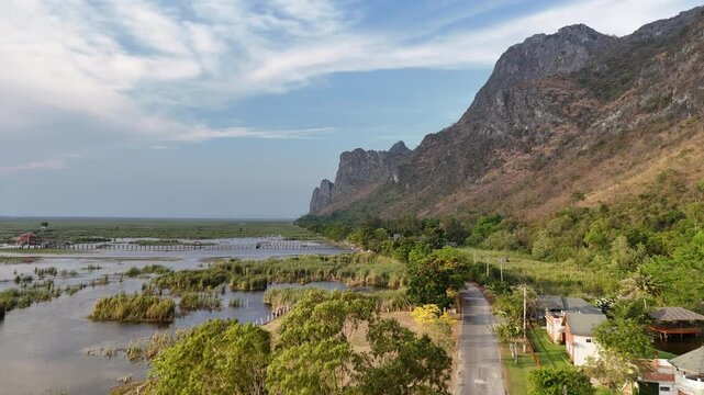 Aerial Drone View Of Bueng Bua Wetlands Thailand
Aerial drone footage of Bueng Bua Wood Boardwalk wetlands and limestone mountains in Thailand on 19 May 2026.
