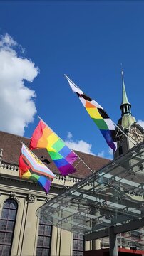 Lgbt rainbow pride flag, intersex inclusive progress flag and straight ally flag waving for pride month, vertical video.	