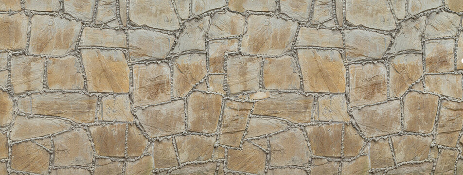 Rough textured stone wall creating natural pattern