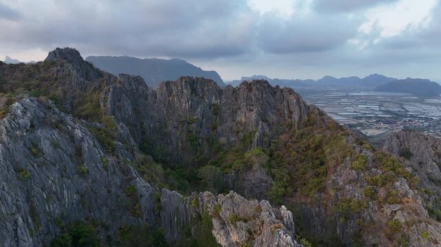 Aerial Drone View Of Khao Daeng Mountains Thailand
Aerial drone footage of dramatic limestone mountains at Khao Daeng View Point in Thailand on 19 May 2026.
