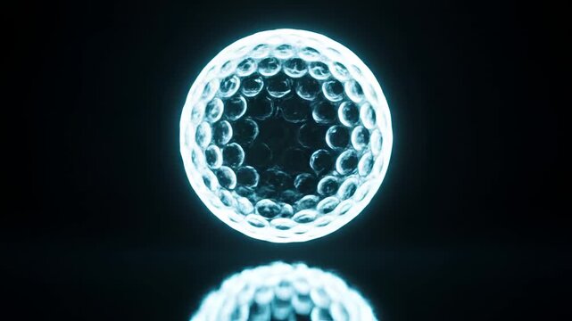 Glowing Golf Ball with Dimples Illuminated in Blue Light.