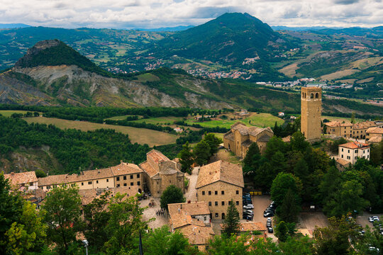 Panoramic mountain village with historic stone buildings and church tower