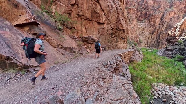 Couple Backpacks into the Grand Canyon on the North Kaibab Trail in Summer