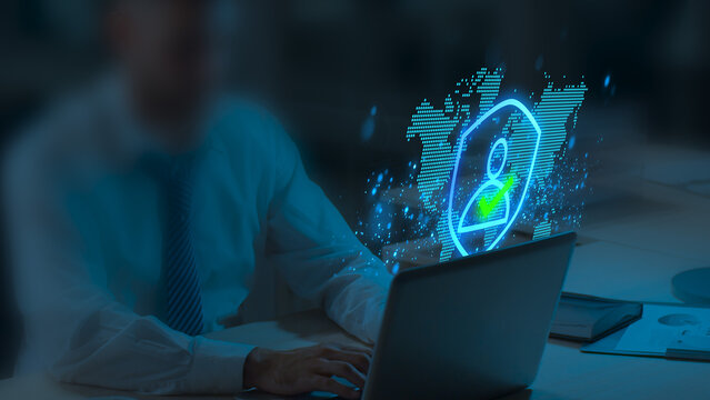 Identity Authentication Technologies. Secure Passwordless Multi-Factor Authentication. Businessperson Tapping Laptop to Use Authenticator Application.