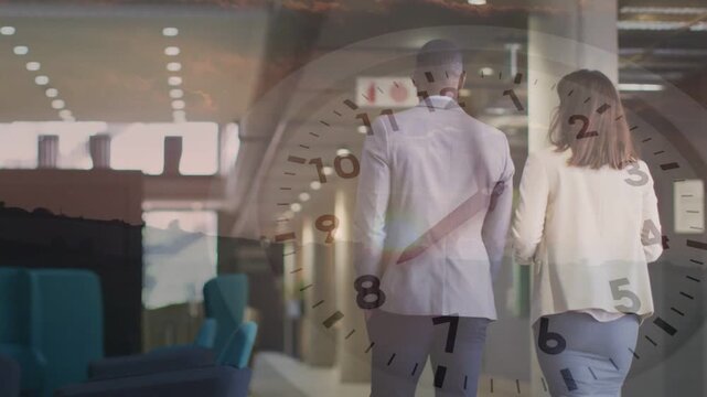 Man and woman walking down office hall by blue chairs, clock overlay showing deadline urging exit