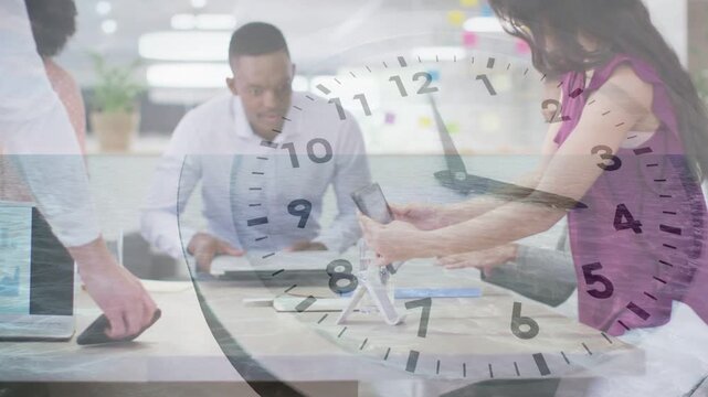 Seated woman pointing, office team exchanging devices reviewing papers, racing under clock graphic