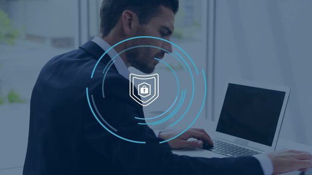 Man in suit typing on laptop, activating security shield with rotating cyan rings protecting data