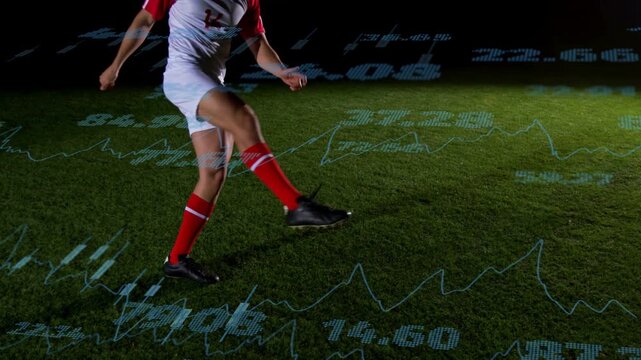 Male player placing ball on foot, juggling, showing skill with projected charts on turf for sports