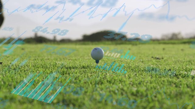 Golfer swinging driver striking white ball sending turf flying while blue charts measuring distance