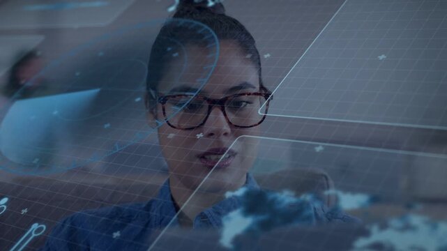 Woman wearing glasses seated onboard viewing AR overlay appearing shifting gaze reading map panels