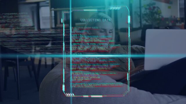Woman reclining on beanbag typing laptop, working on code, HUD overlaying and glitching teal scans