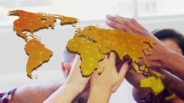 Colleagues stacking hands in office after win, marking teamwork with golden map shifting over hands