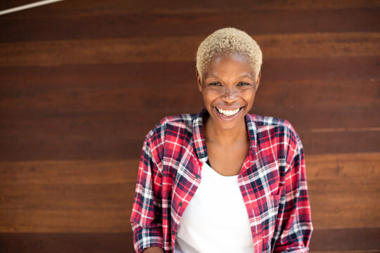 Joyful person in plaid shirt