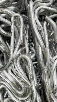 Baled pure aluminium quadrant rods recycled from power cables ready to be used as an ingot substitute 