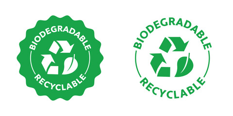 Fototapeta premium Biodegradable and Recyclable stamp with arrows and leaf.