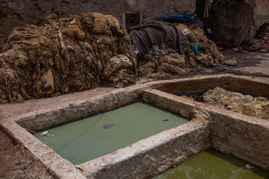 Traditional leather tanning pits operated by Berbers in Morocco
