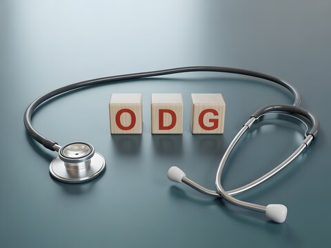 Medical stethoscope and wooden blocks spelling out ODG concept in healthcare service