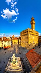 Naklejka premium Historic Stone Palazzo Vecchio Towering Over Busy Piazza Della Signoria in Florence
