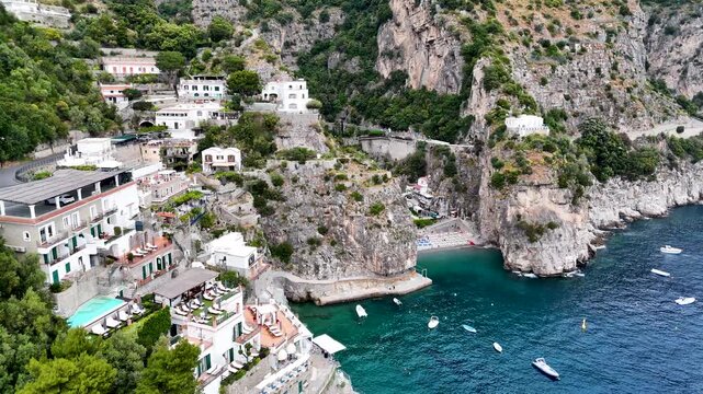 Aerial 4K drone video footage with panorama of Marina di Praia and Praiano coastline, scenic Amalfi Coast landscape with Mediterranean seaside views in Italy