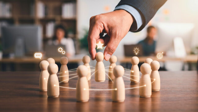 Hand connecting wooden figures in network pattern with leadership star, team collaboration concept, teamwork business, leadership management, organization structure, connected workforce
