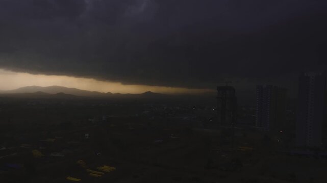 Time lapse of cloudscape, dark clouds over the city, storm rolling in.